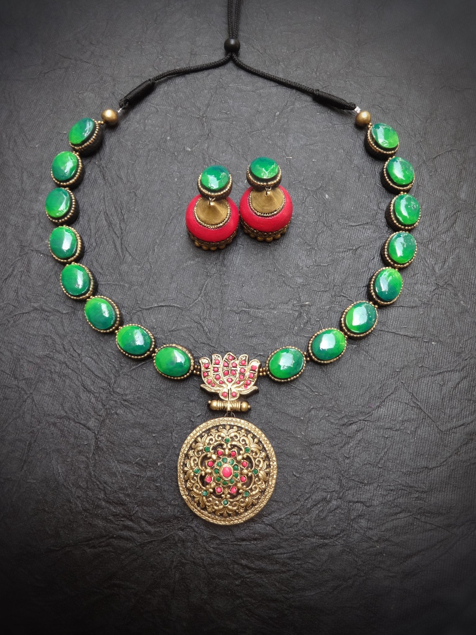 Nilavizhi green oval terracotta necklace with lotus link and pierced gold medallion