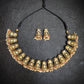 Close view of Sornam gold jhumka charm collar showing pearl fringe detail